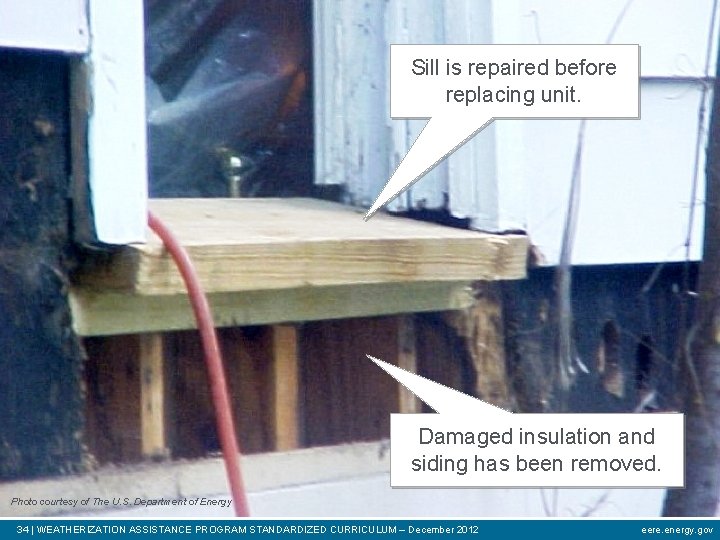 Sill is repaired before replacing unit. Damaged insulation and siding has been removed. Photo