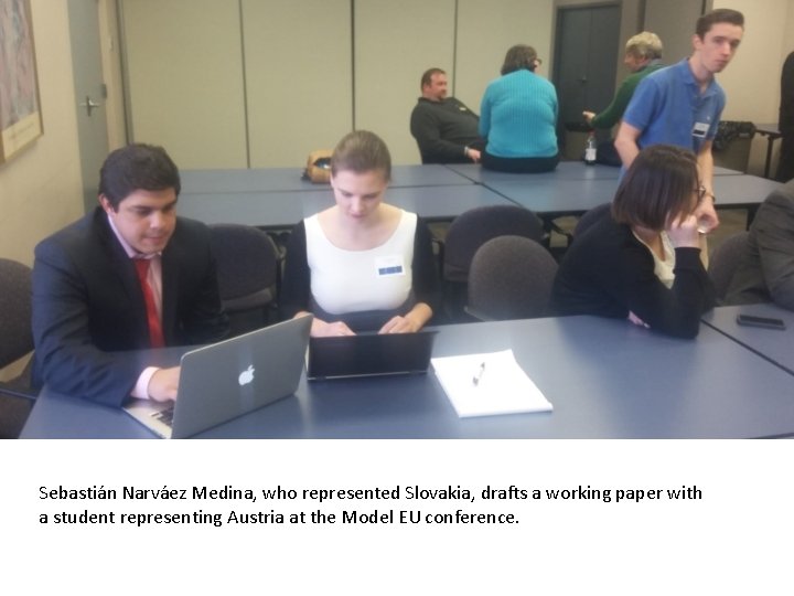 Sebastián Narváez Medina, who represented Slovakia, drafts a working paper with a student representing