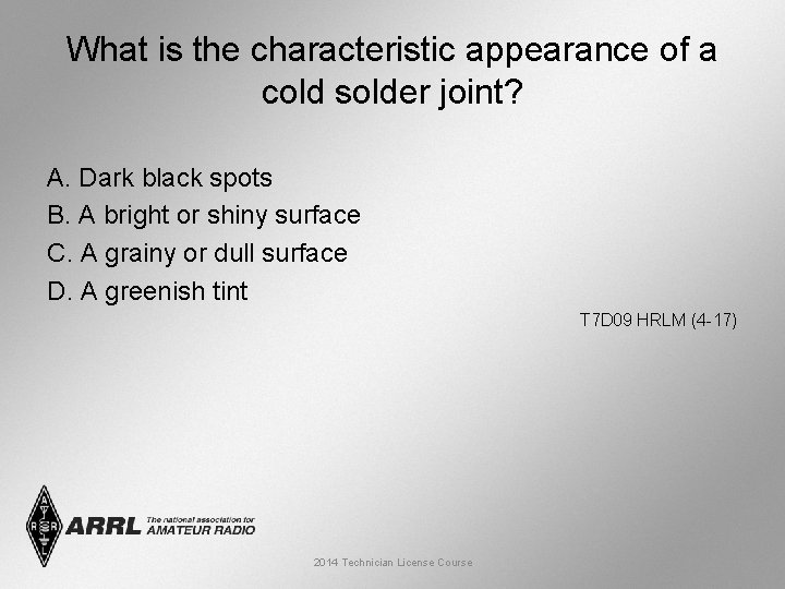 What is the characteristic appearance of a cold solder joint? A. Dark black spots