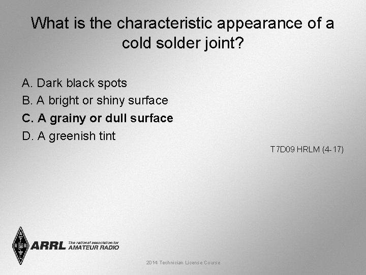 What is the characteristic appearance of a cold solder joint? A. Dark black spots