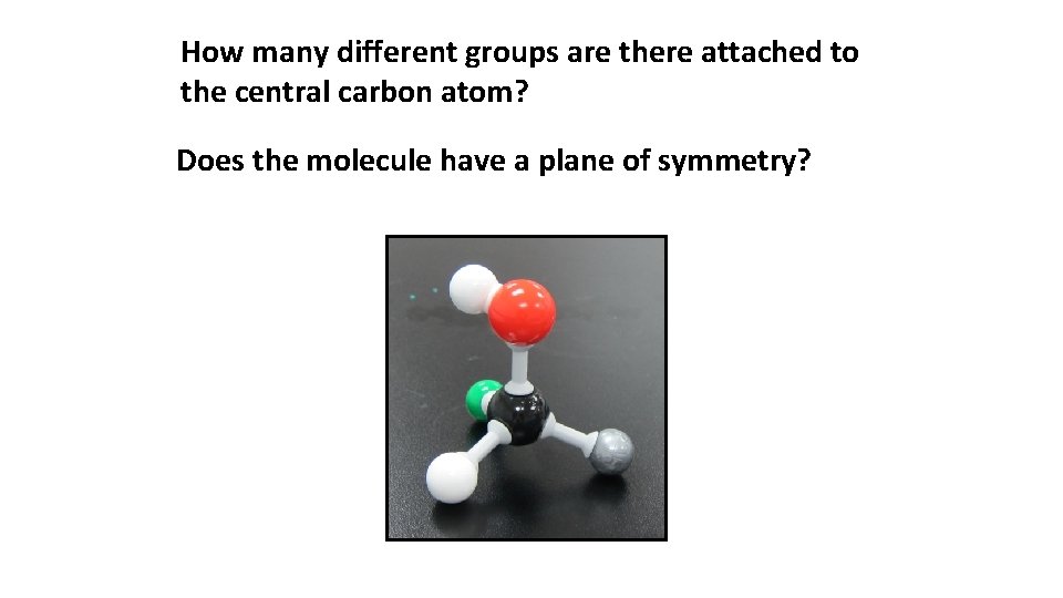 How many different groups are there attached to the central carbon atom? Does the