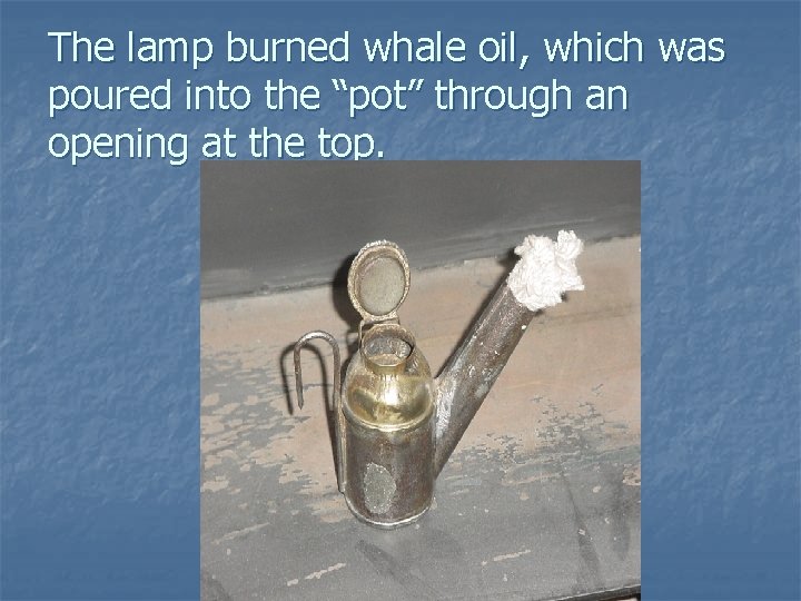The lamp burned whale oil, which was poured into the “pot” through an opening The lamp burned whale oil, which was poured into the “pot” through an opening