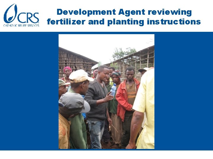 Development Agent reviewing fertilizer and planting instructions 