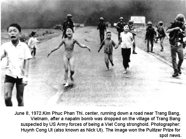 June 8, 1972. Kim Phuc Phan Thi, center, running down a road near Trang