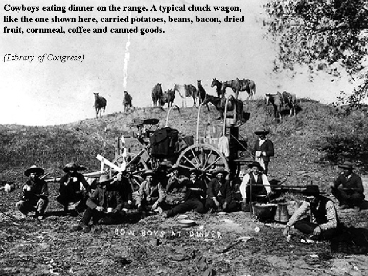 Cowboys eating dinner on the range. A typical chuck wagon, like the one shown