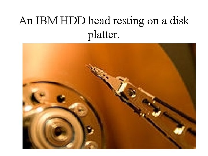 An IBM HDD head resting on a disk platter. 