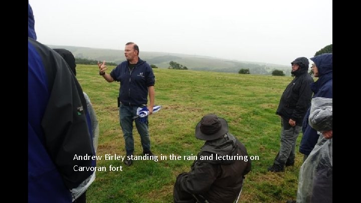 Andrew Birley standing in the rain and lecturing on Carvoran fort 