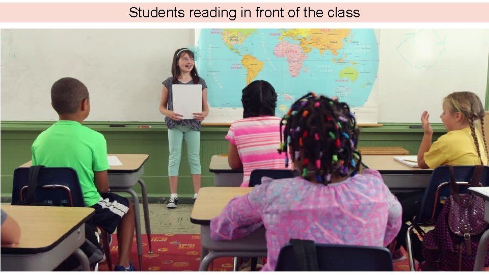 Students reading in front of the class 