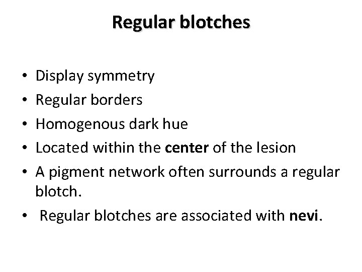 Regular blotches Display symmetry Regular borders Homogenous dark hue Located within the center of Regular blotches Display symmetry Regular borders Homogenous dark hue Located within the center of