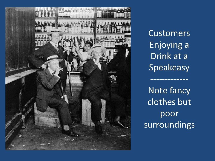 Customers Enjoying a Drink at a Speakeasy ------Note fancy clothes but poor surroundings 